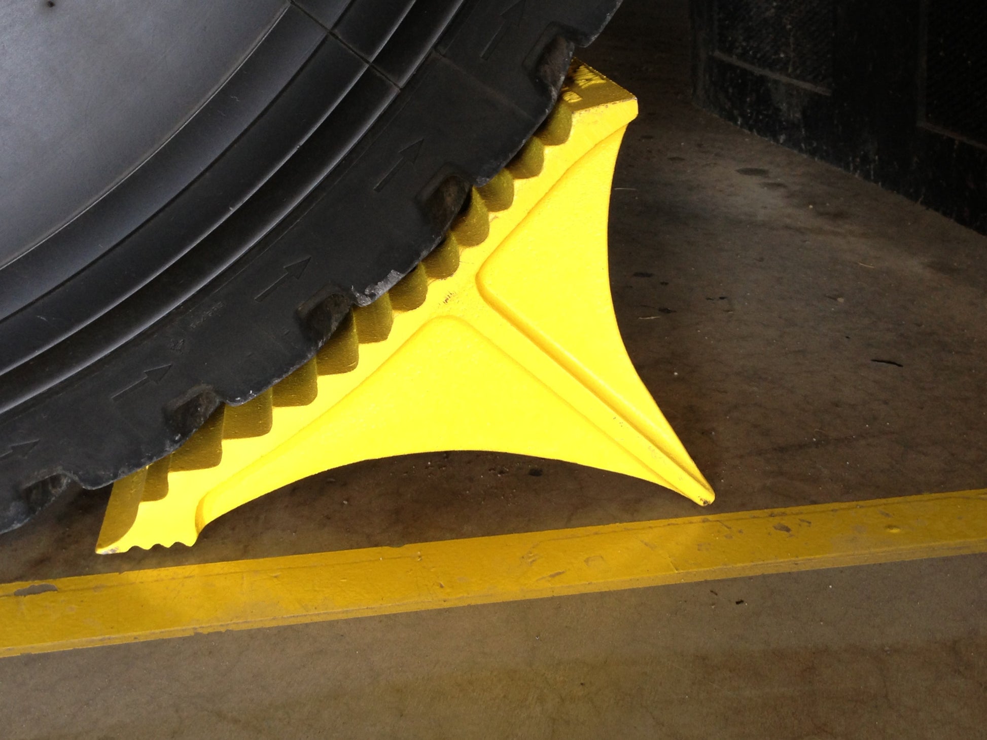 Heavy Duty aluminum cast Wheel Chock by Zephyr Industries holding fire truck in place